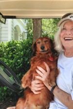 image Sally Walker, a professional dog walker and real estate agent, basks in the open, friendly golf cart culture.