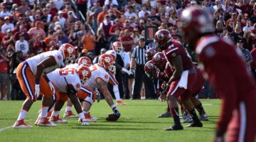 Making Their Communities Proud: Clemson and Carolina Football Players