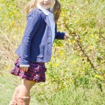 Sierra has fun in this classic schoolgirl outfit. The checkered skirt and blue blazer are by Ralph Lauren and they are paired with a white girls’ button down shirt by Crewcuts Everyday. Outfit provided by Angels & Rascals.