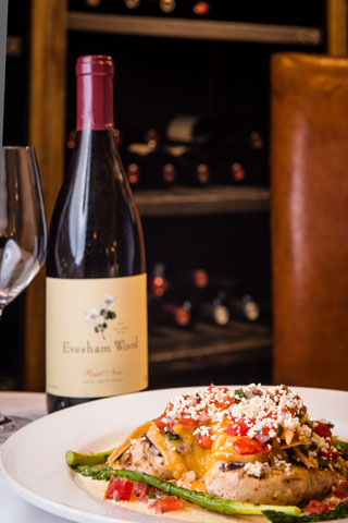 Wood grilled chicken with Mexican cheese, avocado, garlic cream and crisp tortillas served with Evesham Wood Pinot Noir, available only at Red Drum in Mount Pleasant.