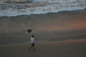 Photo of a man jogging on a local beach