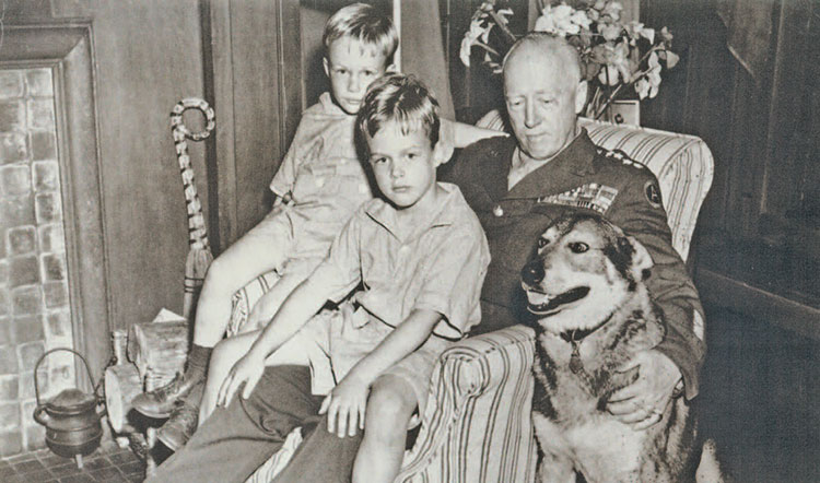 Pat Waters, left, and his older brother John, center, met their grandfather only once, during a 15-day victory tour in the United States. Patton left the dog, Ajax, with Waters’ family when he returned to Europe.
