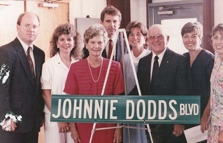 The Dodds family at the dedication of Johnnie Dodds Boulevard. Left to right: Robert Dodds, Joan Dodds, Flo Dodds, John Dodds III, Marilyn Davey, Mayor Johnnie Dodds, Carolyn Nason and Cathy Joyner.