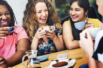 A group of gals celebrating over coffee and tea