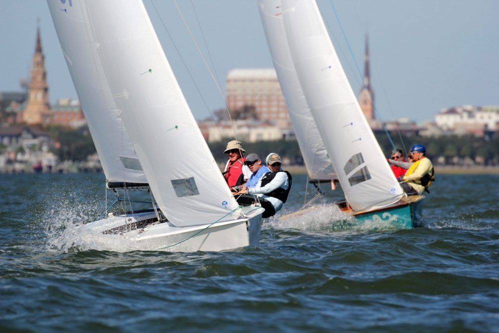 Sailboats race across the waters as the city of Charleston, SC sits pretty as the background