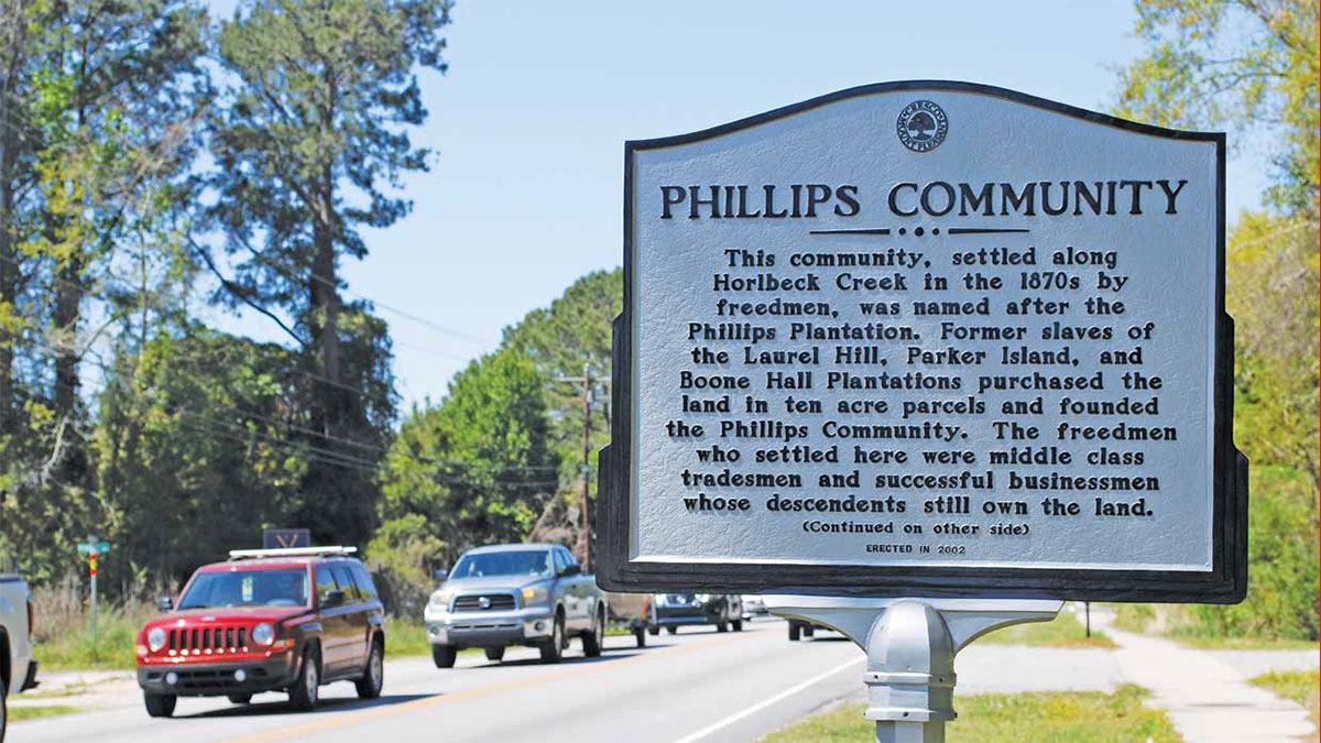 Mount Pleasant, SC sign on Hwy 41 reads: This community, settled along Horlbeck Creek in the 1870s by freedmen, was named after the Phillips Plantation. Former slaves of the Laurel Hill, Parker Island, and Boone Hall Plantations purchased the land in ten acre parcels and younded the Phillips Community. The freedmen who settled here were middle class tradesmen and successful businessmen whose descendants still own the land. (Continued on the other side) Erected in 2002