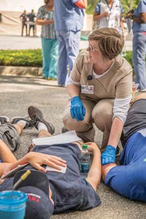 East Cooper Medical Center Emergency Room Tech Amy Hatfield tends to patients during the drill at ECMC.