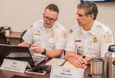 Fire Chief Mike Mixon and Craig Oliverius of the Emergency Services Branch.