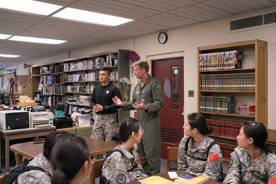 Jiaxin Qu and Aric Southwor th lead a classroom training session