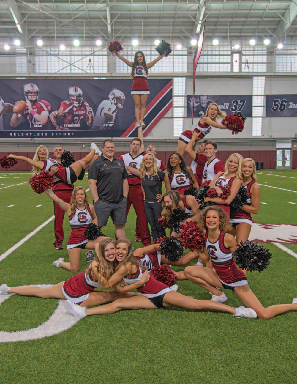 South Carolina Head Coach Erika Goodwin and Assistant Coach Chris Hartshorn surrounded by team members.