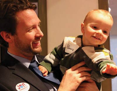 Cunningham celebrating his big win with son, Boone.