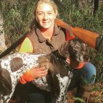 A hunter and her hunting dog