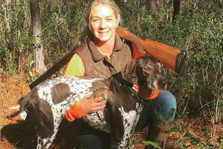 A hunter and her hunting dog