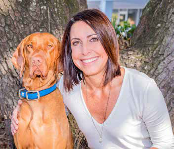 Jenny McKenzie and Rudder, her 4-year- old vizsla.