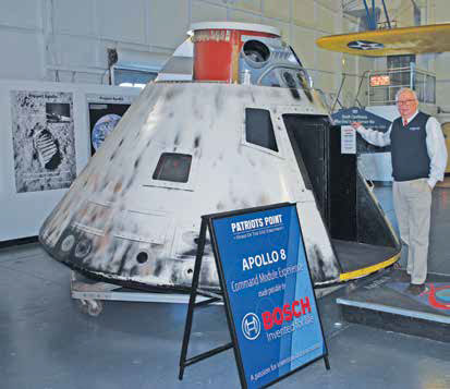 Burdette and the Apollo 8 replica that is now the most popular exhibit at Patriots Point.