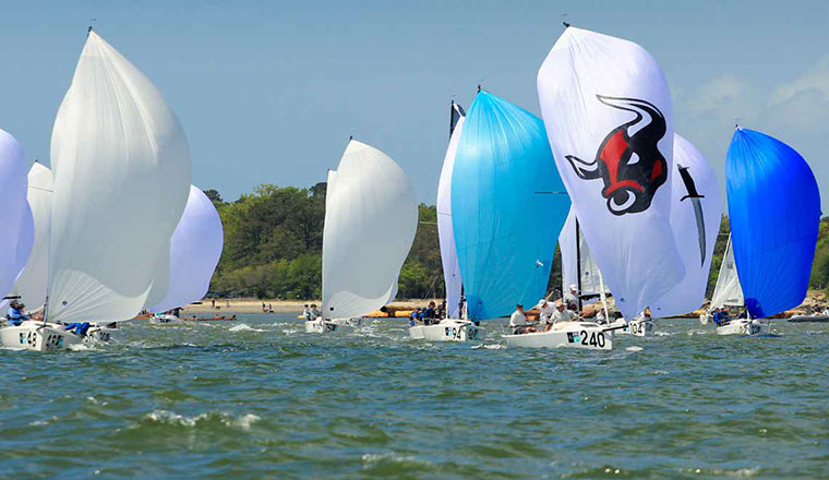Boats in the 2018 competition cut through the rough waves in the downwind leg of the race.