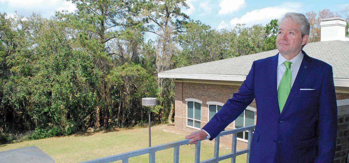 Mike White looks at the courtyard that eventually will be available for games, picnics, cookouts and other activities.