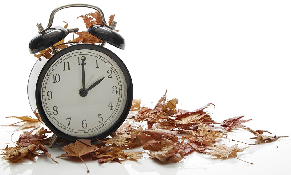 The all-powerful clock, ruler of our schedules withleaves signaling the fall, and end of daylight savings time.