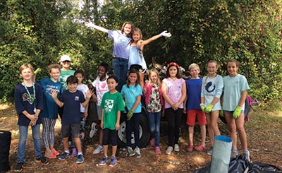 James B. Edwards students par ticipate in oyster shell bagging for the SCORE program.