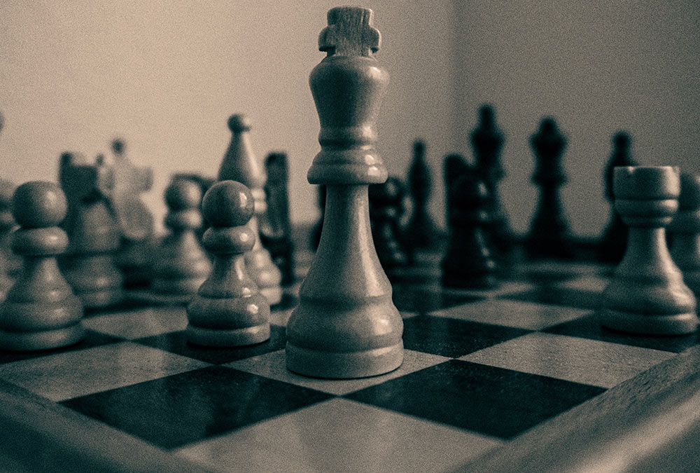 Photo of a chessboard for the 'Local Couples Conquering Business' article. Photo by Sereina on Unsplash.com.