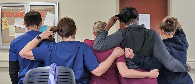 A group wearing Comfort Clip mask clips