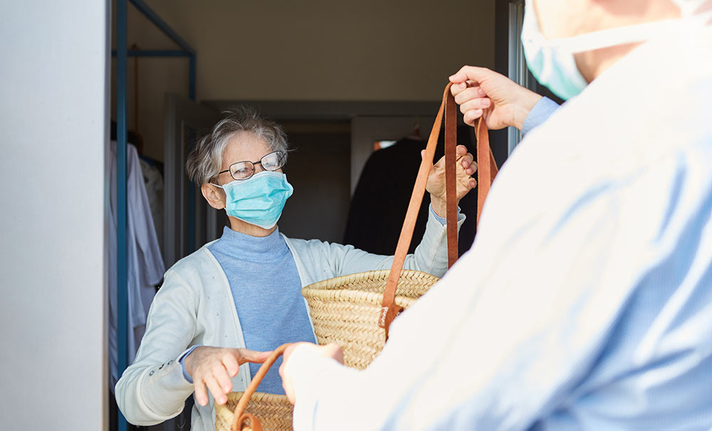 A grocery delivery service brings a shopper's groceries to her door