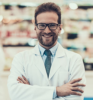 A pharmacist poses for a photo