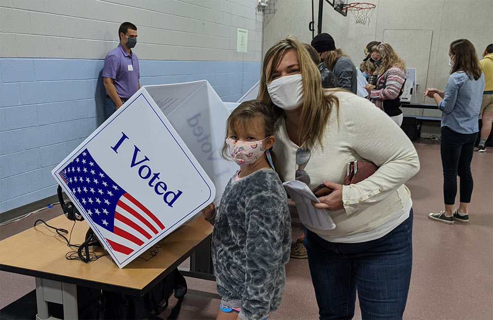 Kristie Rasheed took her daughter Stella to observe her mother and father perform their civic duty as they voted.