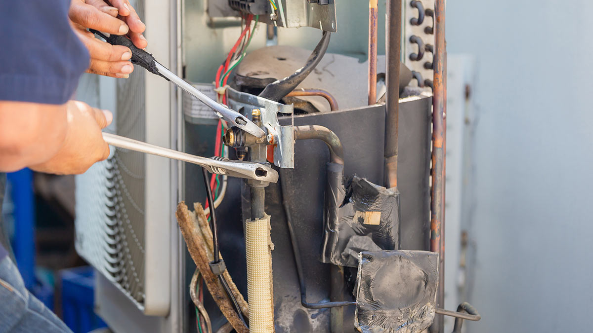 Technician working on an HVAC unit