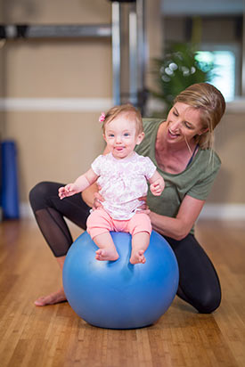 Jill Zimmerman with her daughter playing and moving.