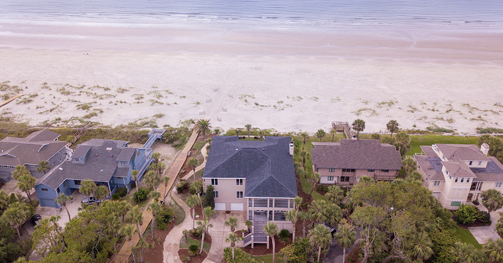 old-looking photo of homes on the beach