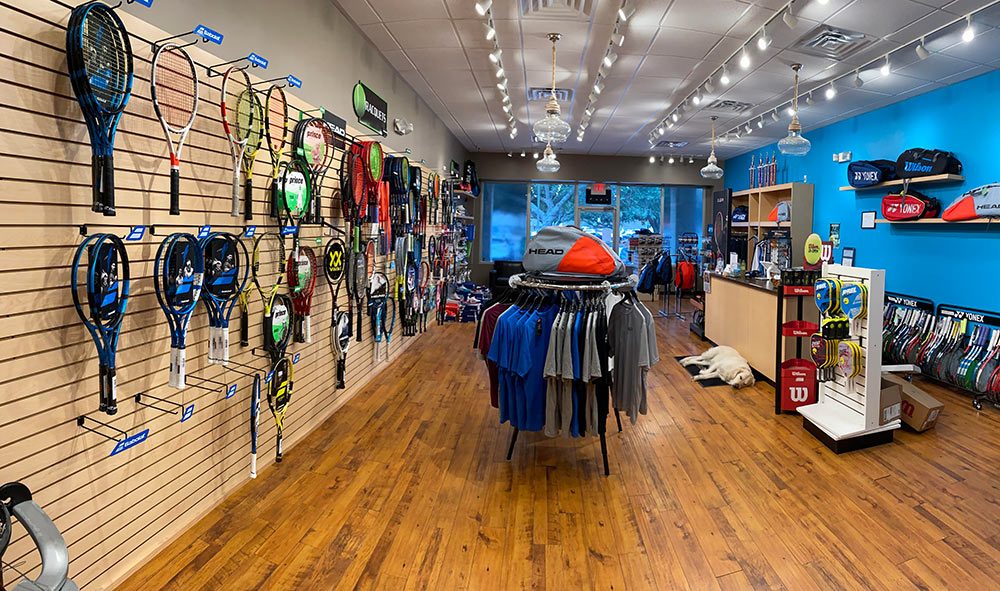 Photo inside of the Holy City Tennis Shop showing lots of great gear