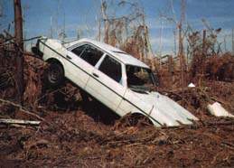 McClellanville, SC a car amidst the ruin after Hurricane Hugo