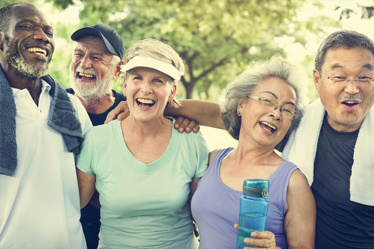 Senior Living lifestyle photo: happy seniors relax after exercising.