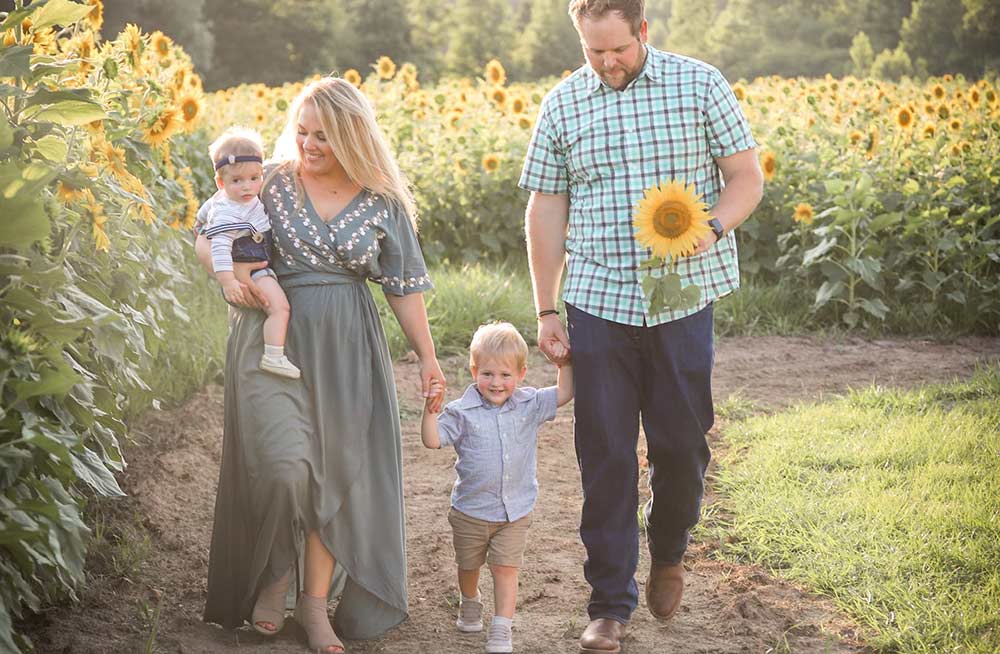 CJ Knighten in photo with her sons Hunter & Jackson and husband Drew. Photo by Well Kept Design.