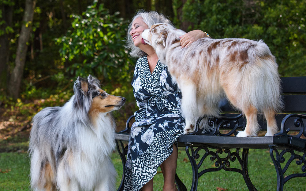 Zelda with her dogs, Ruby, an Australian shepherd and Smokey, a collie. Photo provided by Jeanne Taylor Photography.