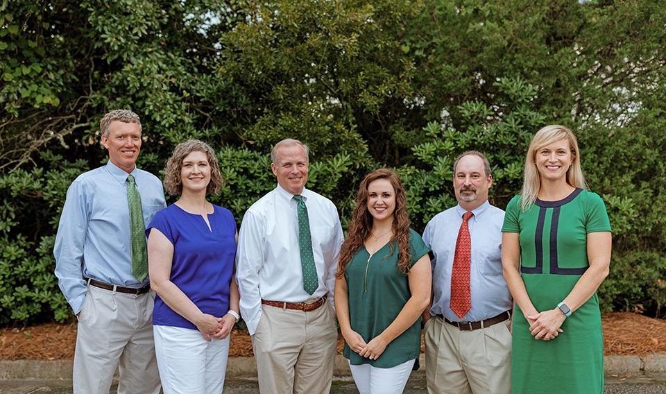 Dr. Bruce Ball (left of center) with other doctors and staff at Charleston Allergy + Asthma
