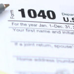 Graphic for tax tips article showing a form 1044 and a pen.