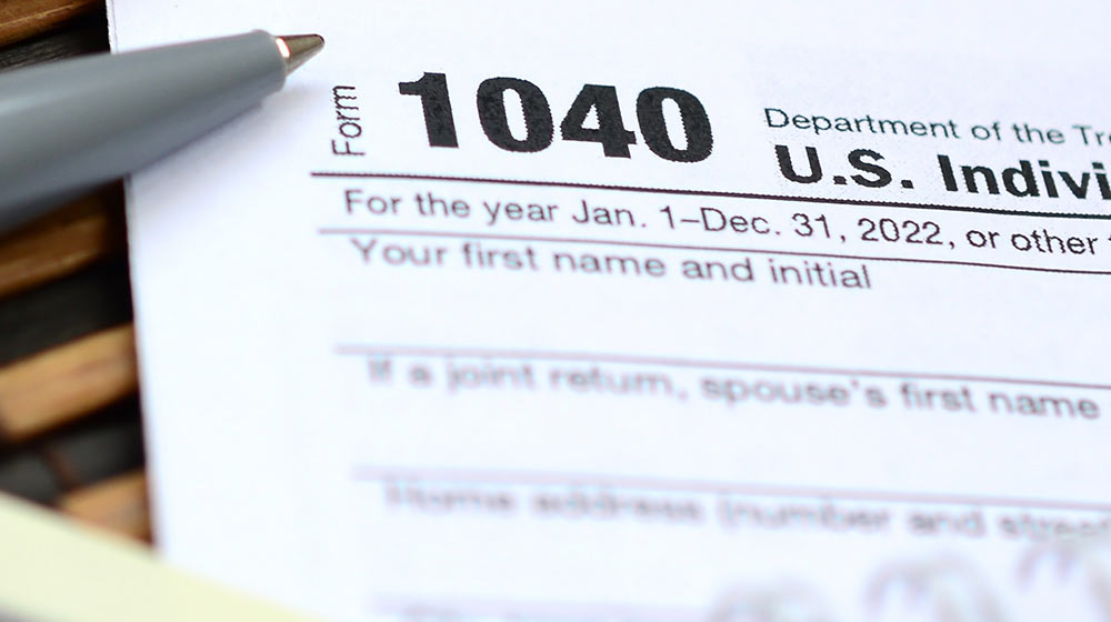 Graphic for tax tips article showing a form 1044 and a pen.