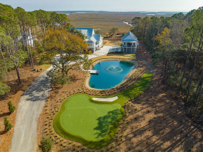 Grandscapes designed pond and putting green.