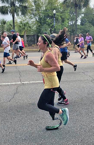 Jenn Andrews running her first race after losing her leg to cancer.