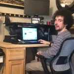 Anthony sitting at his computer.
