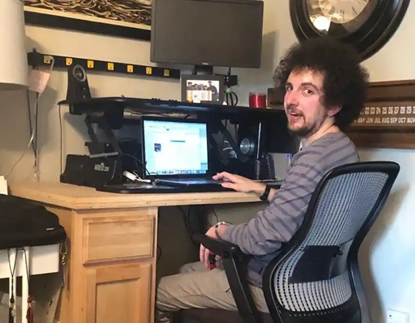 Anthony sitting at his computer.