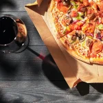 Pizza and a glass of wine.