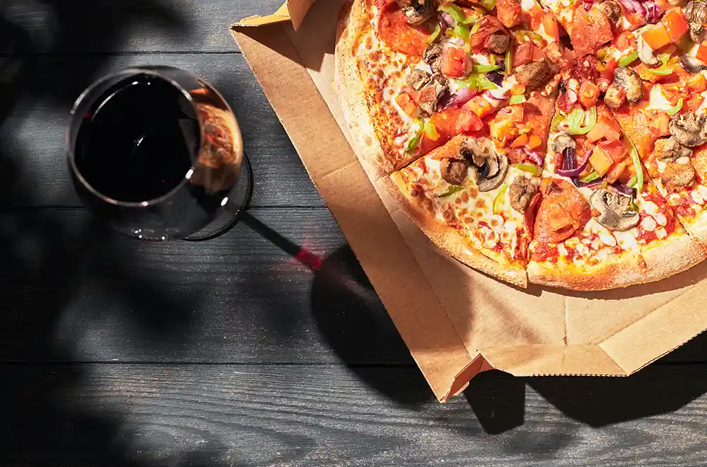 Pizza and a glass of wine.