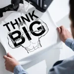 THINK BIG printed on a t-shirt.