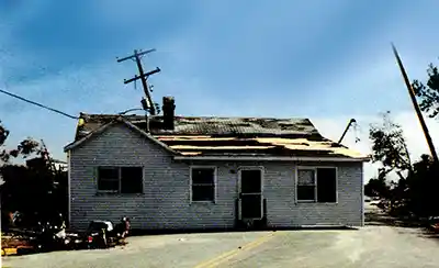 In the aftermath of Hurricane Hugo a house sits on the road.