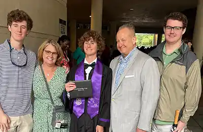 Eli Crowley (center) and family at graduation. 