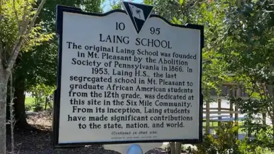 A historical marker at the former site of Laing High School.