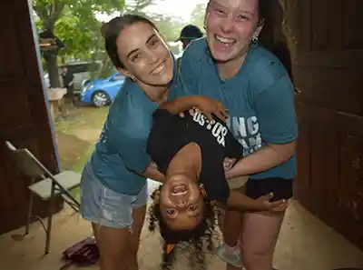 Lucy Beckham High School’s senior cheerleaders distributed bags of essential food to families in need on a service mission to Costa Rica.